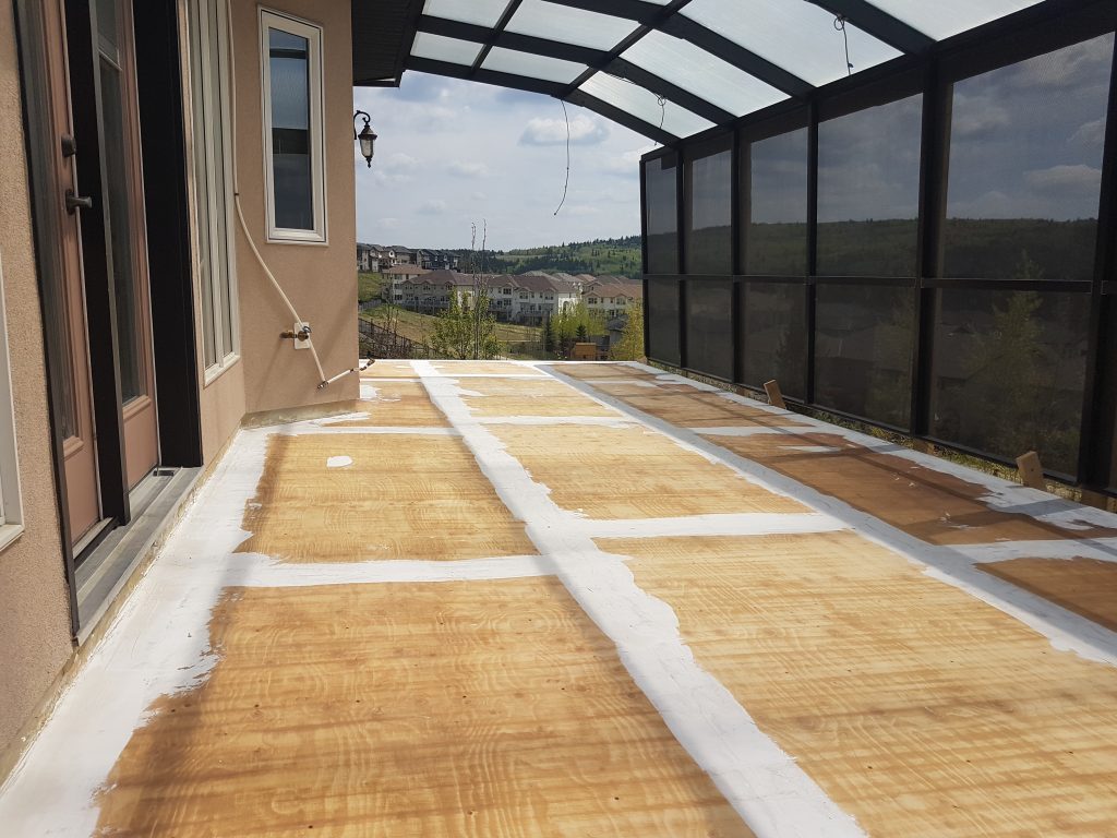 plywood sheet laid out in preparation for a vinyl deck covering